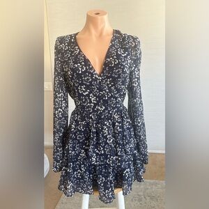Just one. Romper mini dress. Size small. Flowy ruffle bottom, zip back,waist tie